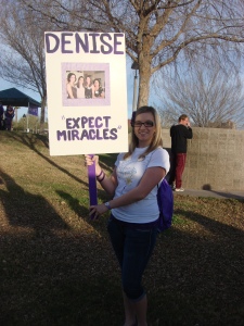 Taylor holding a sign at the Pancreatic Cancer Walk